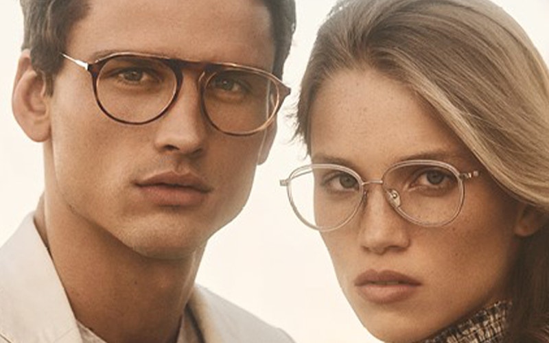 Men and women staring at the camera with glasses on